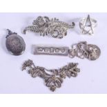 A SILVER INGOT PENDANT etc. (5)