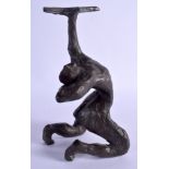 A STYLISH BRONZED PLASTER SCULPTURAL FIGURE modelled holding aloft a star form sconce. 28 cm x 11 cm