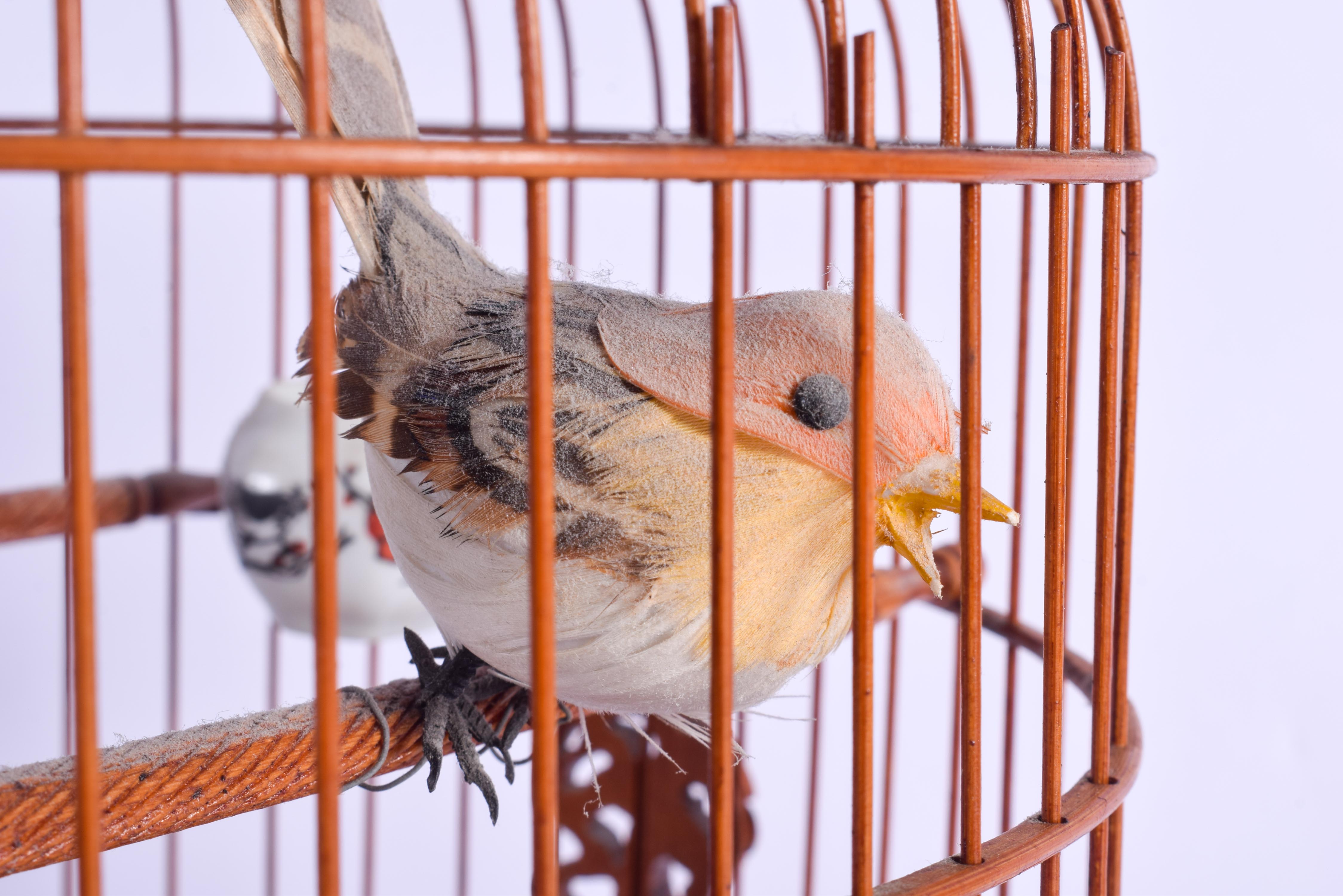 A CHINESE REPUBLICAN PERIOD BAMBOO BIRD CAGE with porcelain feeders. 35 cm x 18 cm. - Image 3 of 4