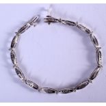 A WHITE GOLD AND DIAMOND BRACELET. 8.6 grams. 17 cm long.