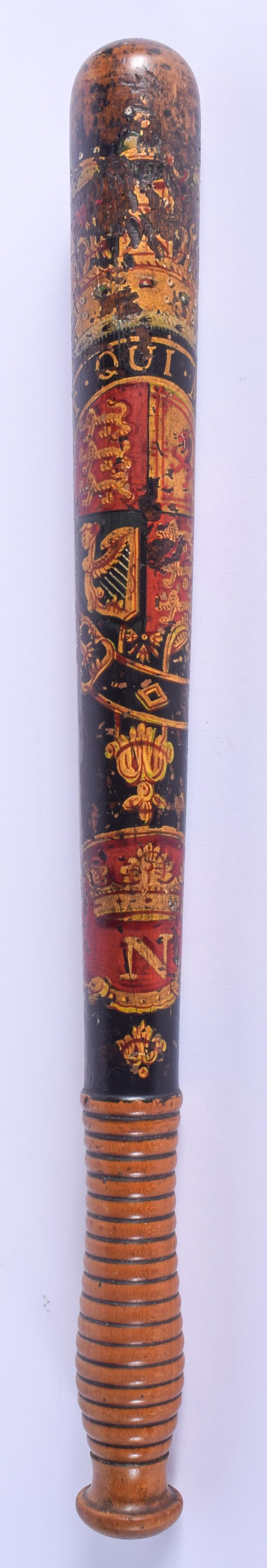 A WILLIAM IV PAINTED WOOD TRUNCHEON. 42 cm long.