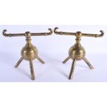 A PAIR OF ARTS AND CRAFTS BRASS CHENETS in the manner of Dr Christopher Dresser. 18 cm x 18 cm.