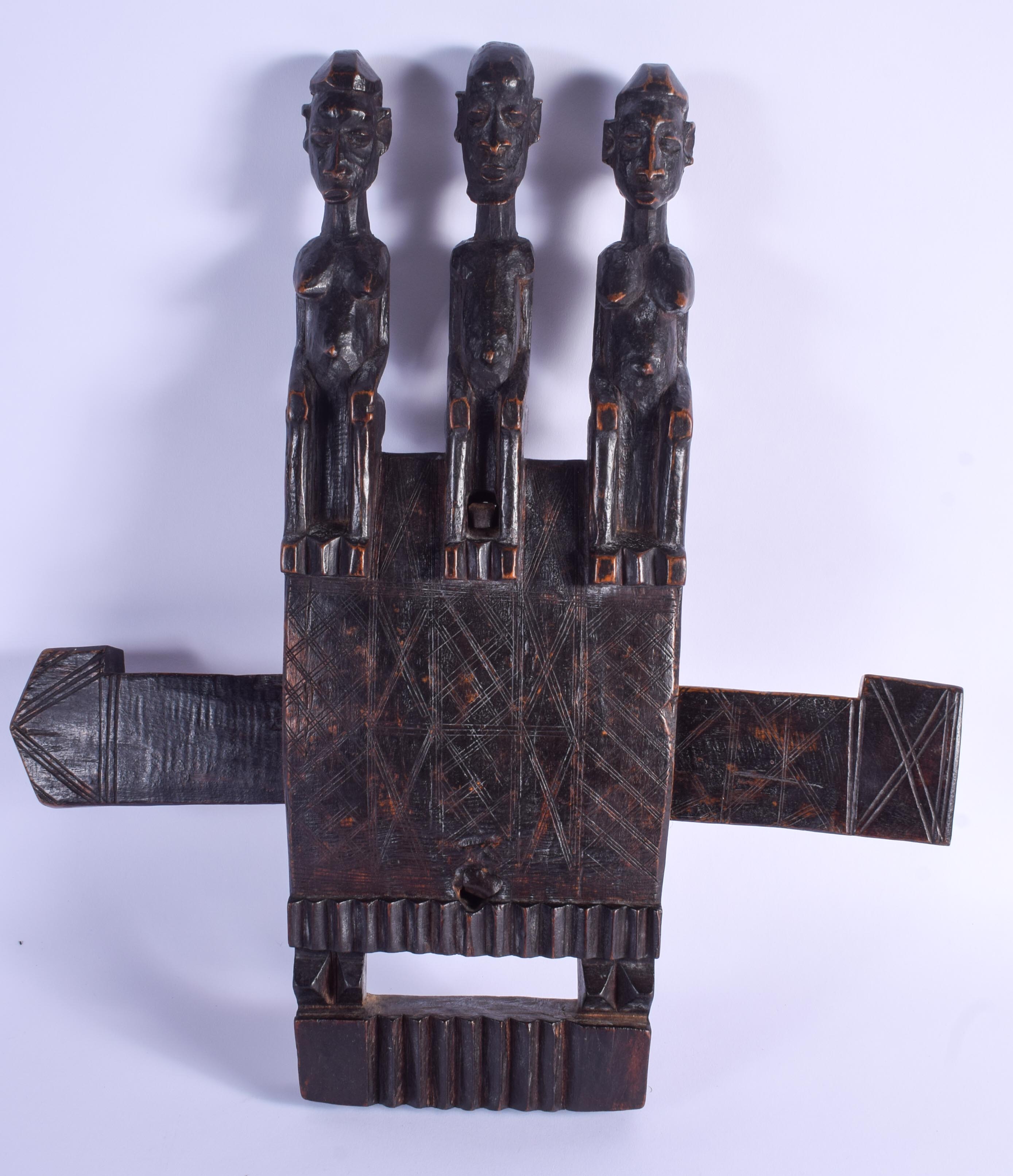 AN EARLY 20TH CENTURY AFRICAN DOGON TRIPLE FIGURE DOOR LOCK. 45 cm x 40 cm.