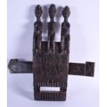 AN EARLY 20TH CENTURY AFRICAN DOGON TRIPLE FIGURE DOOR LOCK. 45 cm x 40 cm.