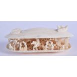 A 19TH CENTURY CHINESE CANTON CARVED IVORY CLAM SHELL. 8.5 cm x 2 cm.