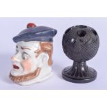 AN IRISH BOG OAK PIN HOLDER and a porcelain head. (2)