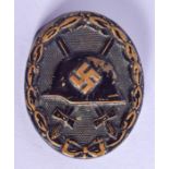 A GERMAN MILITARY HELMET BADGE. 4.5 cm wide.