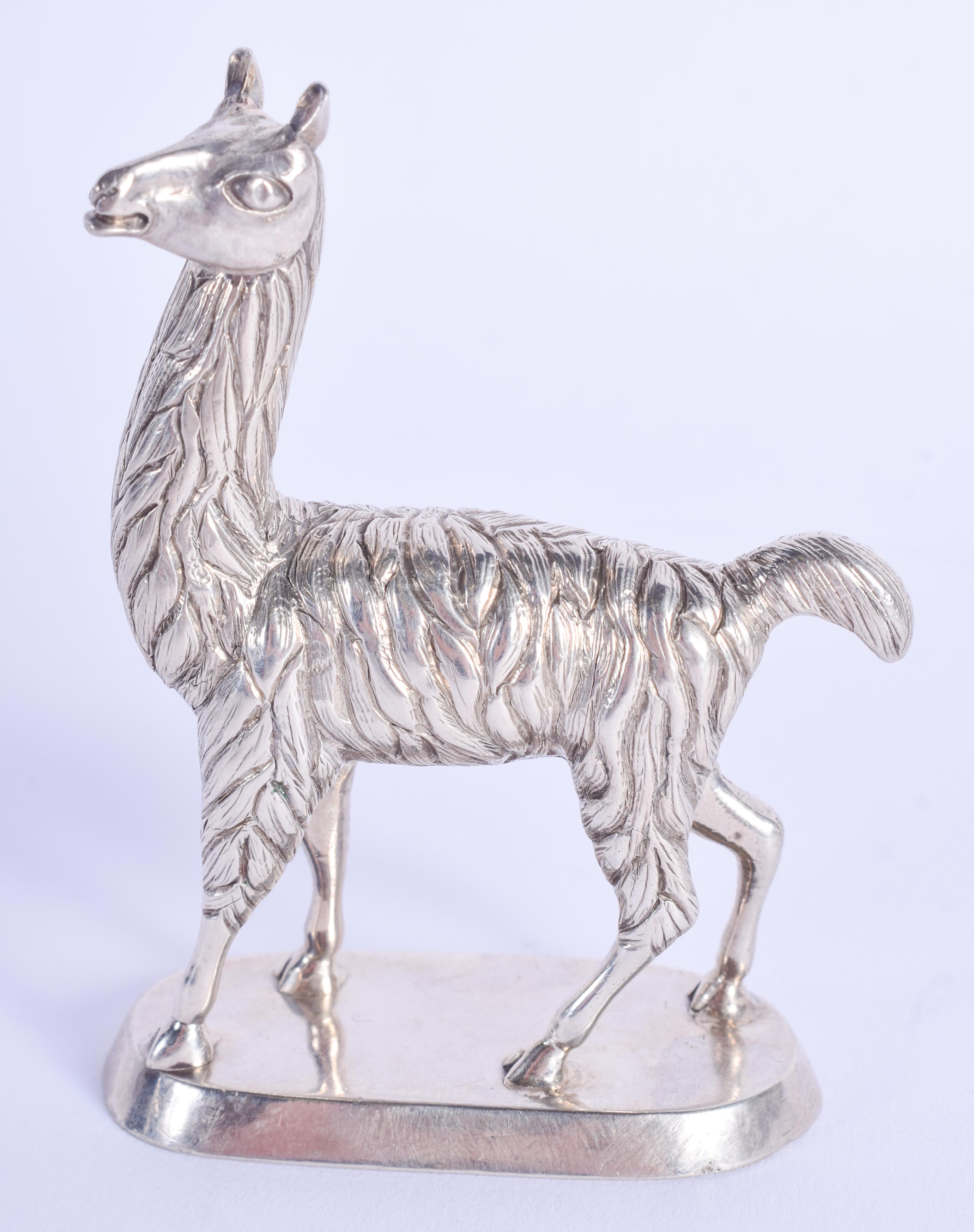 A CONTINENTAL WHITE METAL LAMA. 93 grams.