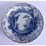 AN EARLY 18TH CENTURY JAPANESE EDO PERIOD BLUE AND WHITE SCALLOPED DISH painted with immortals. 30 c