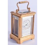 A CONTEMPORARY BRASS SILVERED DIAL CARRIAGE CLOCK. 7.5 cm high inc handle.