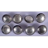 EIGHT CHINESE WHITE METAL COIN BUTTONS. 210 grams. (8)