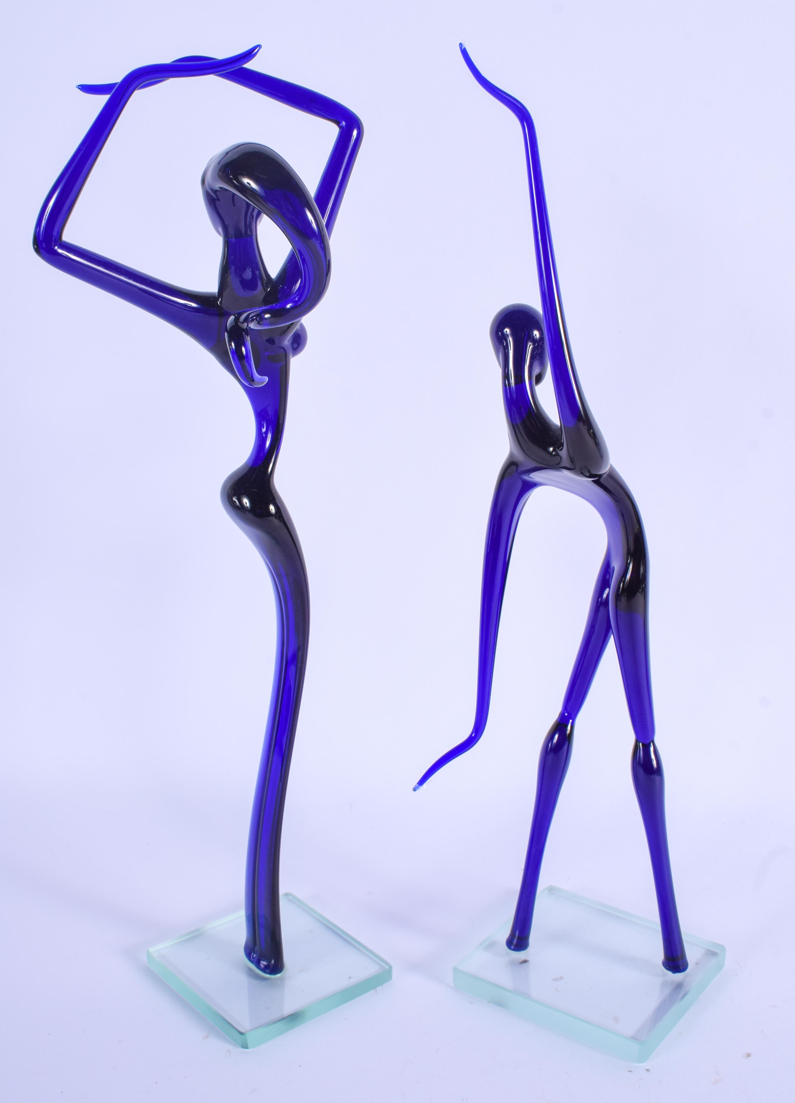 A RETRO PAIR OF EUROPEAN BLUE GLASS FIGURES. 32 cm high. - Image 2 of 2