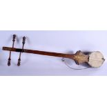 AN EARLY 20TH CENTURY MIDDLE EASTERN ISLAMIC INSTRUMENT. 117 cm high.