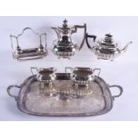 AN ANTIQUE SILVER PLATED TRAY with associated four piece teaset and a spoon holder. Tray 50 cm x 36