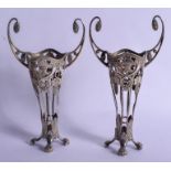 A PAIR OF ANTIQUE CONTINENTAL WHITE METAL VASES. 284 grams. 21 cm high.