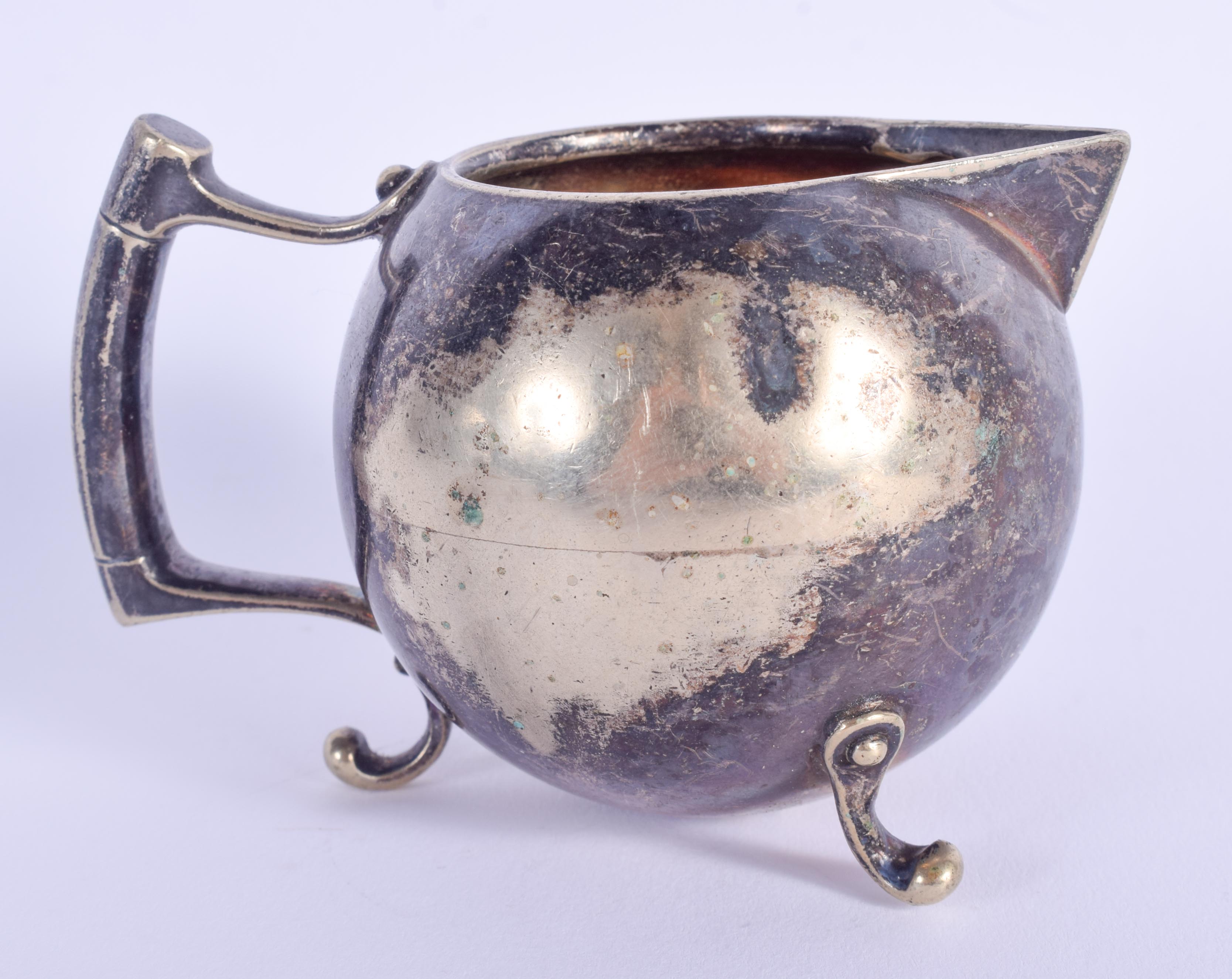 AN ARTS AND CRAFTS CHRISTOPHER DRESSER SILVER PLATED CREAM JUG. 109 grams. 8 cm wide. - Image 2 of 4