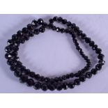 A VINTAGE WHITBY JET NECKLACE. 86 cm long.