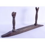 AN UNUSUAL EARLY 20TH CENTURY TRIBAL CARVED WOOD WEAPON REST decorated with angular motifs. 66 cm x
