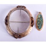 AN ANTIQUE YELLOW METAL LOCKET together with an opal locket. 22 grams. (2)