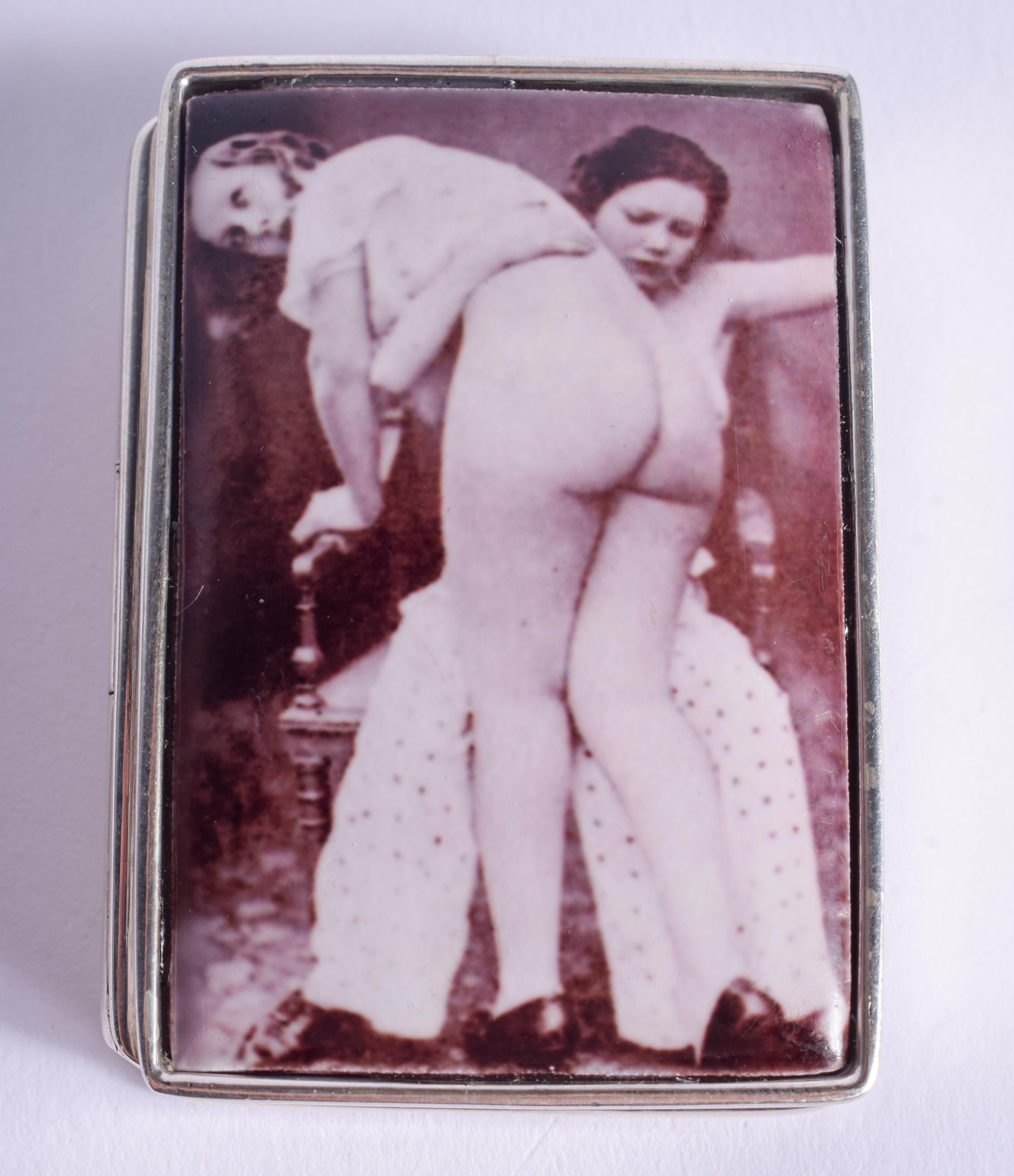 A SILVER SPANKING PILL BOX. 3.5 cm x 5 cm.