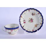 18th c. Worcester fluted teacup and saucer painted with swags of flowers around a central bouquet bo