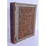 A RARE LARGE 19TH CENTURY MIDDLE EASTERN IVORY AND SANDALWOOD BOOK COVER decorated with elephants an