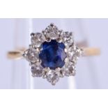 AN ANTIQUE GOLD DIAMOND AND SAPPHIRE CLUSTER RING. 3.5 grams. J/K.