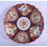 A 19TH CENTURY JAPANESE MEIJI PERIOD SCALLOPED DISH painted with figures and Buddhistic lions. 30 cm