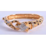A STYLISH CARTIER STYLE PANTHER BANGLE. 6.5 cm wide.