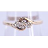 A 9CT GOLD THREE STONE DIAMOND RING. 2.5 grams. O/P.