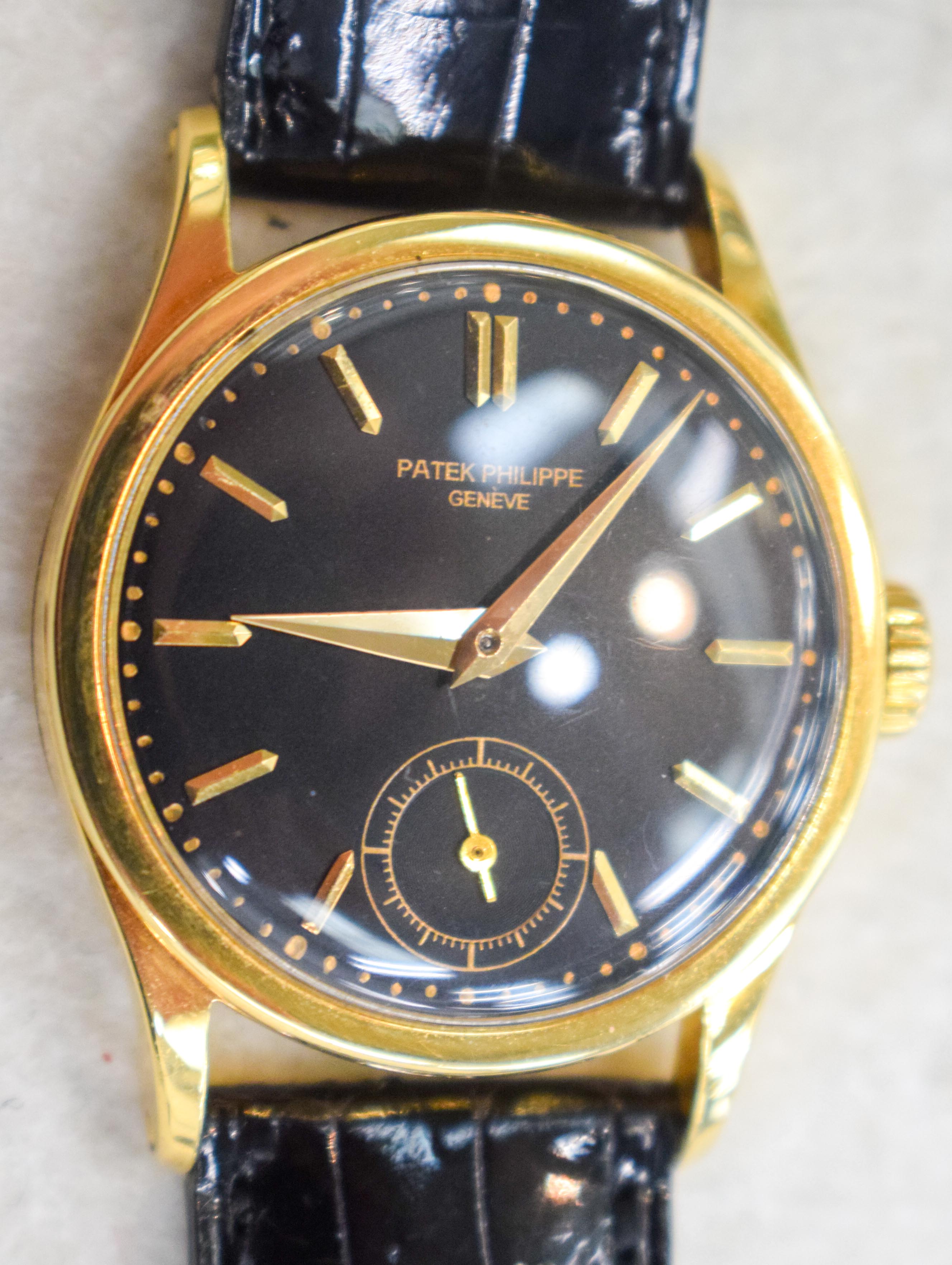 A RARE 18CT GOLD PATEK PHILIPPE BLACK DIAL WRISTWATCH with 18ct gold strap. Dial 3 cm diameter, Stra - Image 7 of 16