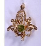 AN ART NOUVEAU 15CT GOLD AND PERIDOT PENDANT. 5.8 grams. 4.5 cm x 2.5 cm.