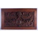 AN ANTIQUE CONTINENTAL CARVED WOOD PLAQUE with central EF monogram. 65 cm x 36 cm.