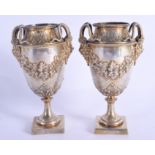A PAIR OF 19TH CENTURY CONTINENTAL SILVER VASES. 524 grams. 16 cm x 6 cm.