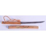 AN UNUSUAL JAPANESE CARVED WOOD CASED KNIFE. 21 cm long.