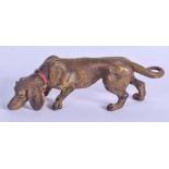 A COLD PAINTED BRONZE DOG. 12 cm x 4 cm.