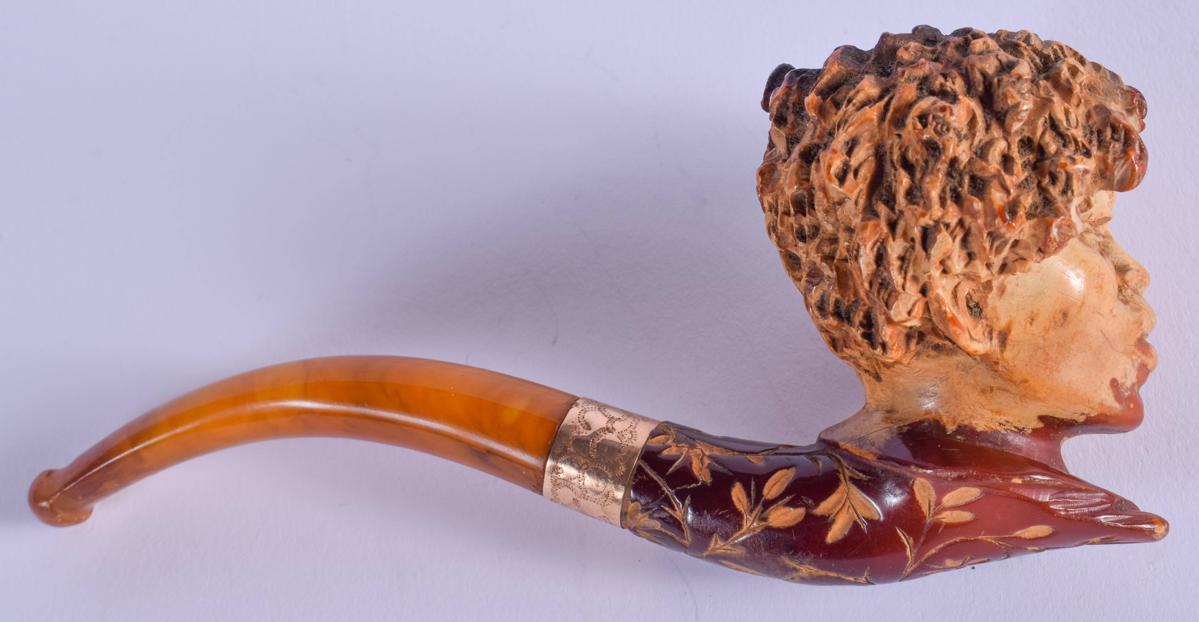 A 19TH CENTURY CONTINENTAL CARVED MEERSCHAUM AND AMBER PIPE. 13 cm long. - Image 2 of 2