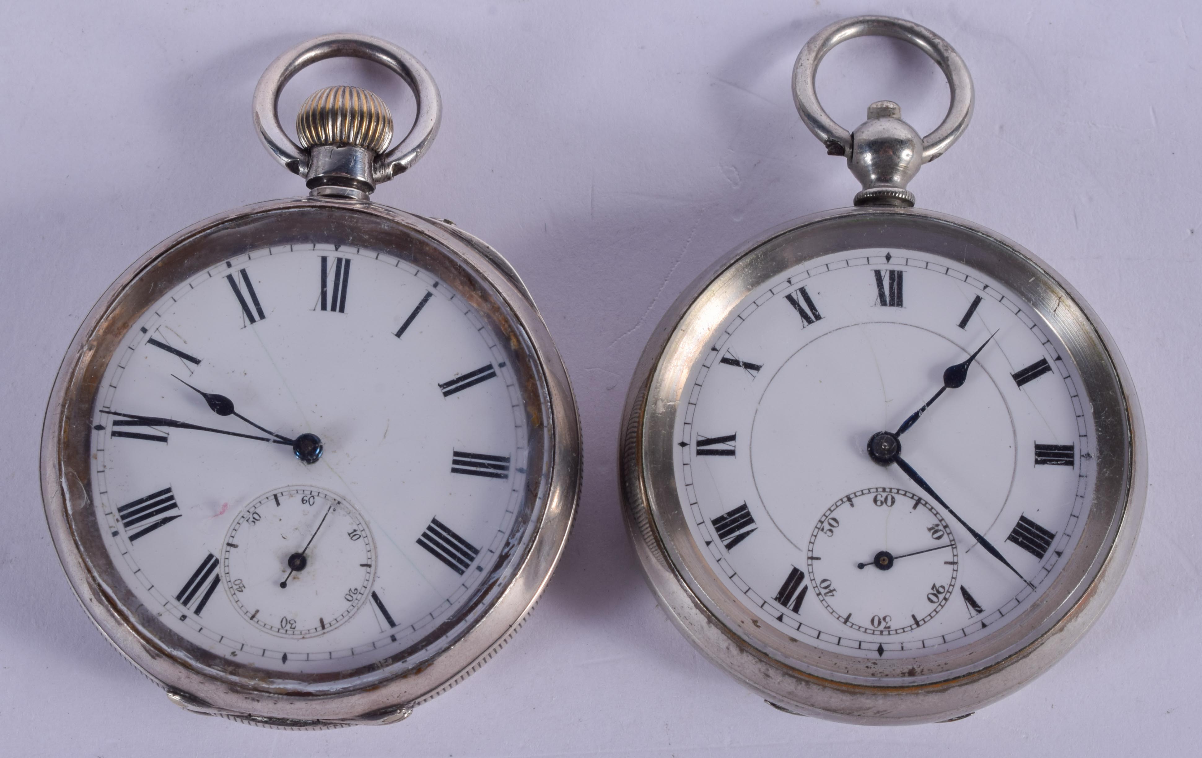 AN ANTIQUE SILVER POCKET WATCH and another plated watch. Largest 5.25 cm diameter. (2)