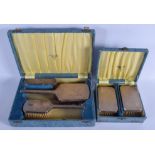 FIVE CASED 1950S SILVER BACK BRUSHES. Birmingham 1954. 700 grams overall. (5)