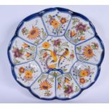 A LARGE 19TH CENTURY DUTCH DELFT FAIENCE TIN GLAZED DISH painted with birds. 30 cm wide.