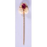 AN UNUSUAL 19TH CENTURY GOLD RUBY AND TOOTH TIE PIN possibly a Pink Sapphire. 3.2 grams. 6.5 cm long