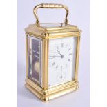 AN ANTIQUE FRENCH REPEATING BRASS CARRIAGE CLOCK with sonnerie & silence features. 16 cm high inc ha