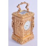 A CONTEMPORARY BRASS FIGURAL CARRIAGE CLOCK. 8.5 cm high inc handle.