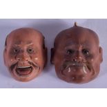 TWO JAPANESE MEIJI PERIOD PAINTED NOH MASKS. 6 cm x 4 cm.