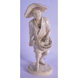 A 19TH CENTURY JAPANESE MEIJI PERIOD CARVED TOKYO SCHOOL IVORY OKIMONO modelled as a male throwing g