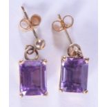 A PAIR OF 9CT GOLD AND AMETHYST EARRINGS. 3.6 grams. 1.5 cm long.