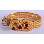 AN UNUSUAL ANTIQUE YELLOW METAL AMETHYST AND RUBY BRACELET. 32 grams. 15 cm long.