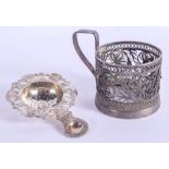 AN ANTIQUE RUSSIAN SILVER FILIGREE CUP HOLDER and a silver strainer. 120 grams. (2)