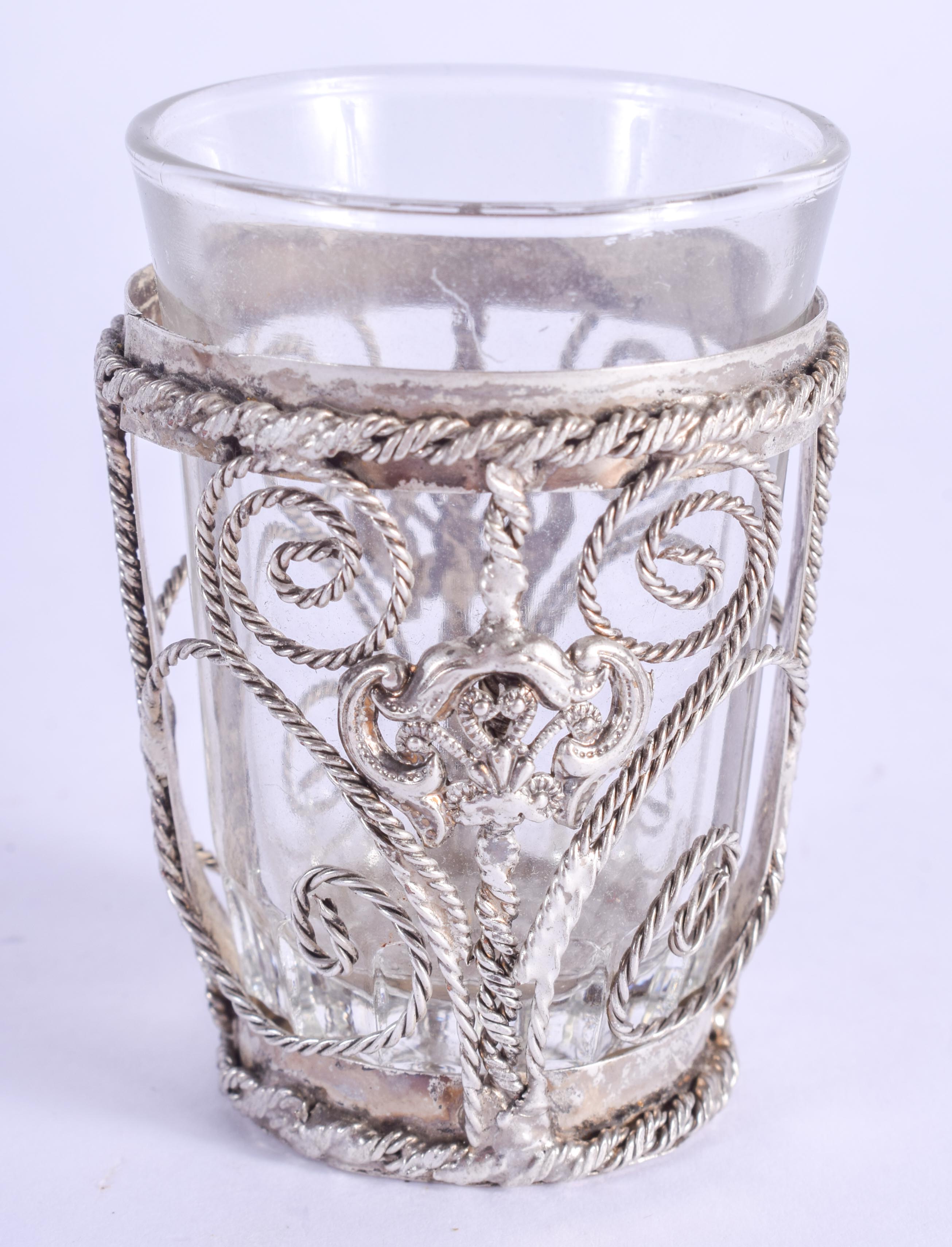 A SMALL VINTAGE WHITE METAL CASED SHOT GLASS. 7 cm high.