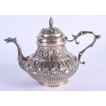 AN ANTIQUE CONTINENTAL SILVER TEAPOT decorated with foliage and vines. 442 grams. 17 cm x 13 cm.